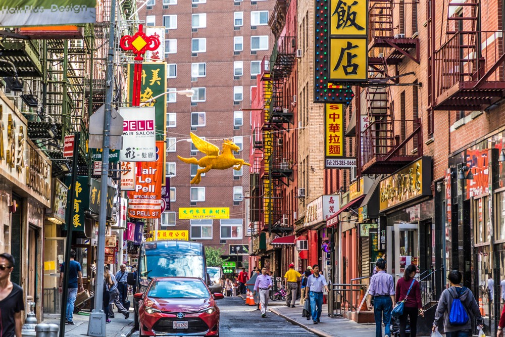 NEW YORK, USA - OCT 5, 2017: chinatown with shops with chinese letters and pegasus in Chinatown, New York.