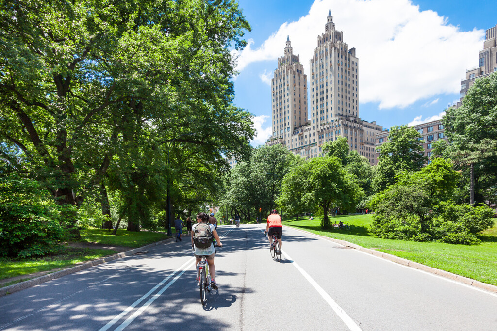 NEW YORK CITY, NEW YORK, USA - JUNE 14, 2014: Cyclists and joggers on Central Park East Drive on June 14, 2014. Central Park is a haven for the active lifestyle during the summer season.
